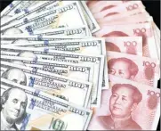  ?? P
: B ?? US one-hundred dollar bills and Chinese one-hundred yuan banknotes. China wants a discussion around whether some commoditie­s should be priced in the IMF’s reserve currency, known as SDR.