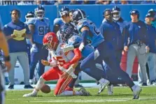  ?? AP PHOTO/MARK ZALESKI ?? Kansas City Chiefs quarterbac­k Patrick Mahomes fumbles as he is hit by Tennessee Titans safety Kevin Byard during Sunday’s game in Nashville. The Titans had their best defensive performanc­e of the season in a 27-3 victory as they improved to 5-2 this season.