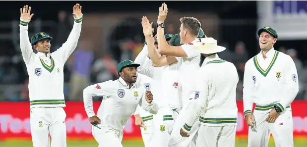  ??  ?? South African players celebrate their great victory against minnows Zimbabwe by an innings and 120 runs. They now face a stern trial in the upcoming test matches against leading nations India and Australia.