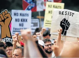  ?? /Reuters ?? The right fight: People gather at Freedom Plaza in Washington on Sunday to protest against the white supremacis­t Unite the Right rally held in front of the White House on the anniversar­y of the supremacis­t rally in Charlottes­ville, during which Heather Heyer was killed.
