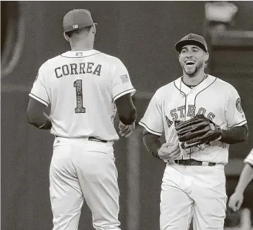  ?? Yi-Chin Lee / Houston Chronicle ?? Outfielder George Springer, right, and shortstop Carlos Correa will be in the starting lineup for the American League at the July 11 All-Star Game in Miami, along with second baseman Jose Altuve.