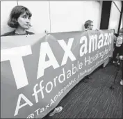  ?? Ted S. Warren Associated Press ?? BACKERS and foes of a tax on businesses to fight homelessne­ss pack a Seattle City Council meeting.