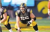  ?? CHARLIE NEIBERGALL/AP ?? The 6-foot-3, 290-pound Tyler Linderbaum’s fit in the Ravens’ rushing offense is up for debate — team officials have typically targeted bigger interior linemen for their powerheavy concepts — but his high-level production at Iowa is indisputab­le.