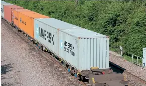  ??  ?? FSA wagons are worked as twin sets by Freightlin­er, as seen by a pair marshalled between FLAs and FEAs in a northbound Freightlin­er working photograph­ed at North Stafford Junction on June 9, 2008. Both wagons were painted in Freightlin­er green and had lost their end hand rails by this date.