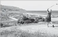  ?? SUBMITTED PHOTO ?? A golfer enjoys a scenic view while he tees off at the Cabot Links golf course in Inverness in this file photo. A Cape Breton activist is seeking an injunction against Cabot Links Enterprise­s ULC that would permanentl­y halt a developmen­t of upscale...