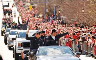  ?? AP PHOTO/ALEX SLITZ ?? Georgia football players acknowledg­e the crowd during a Jan. 14 parade in Athens celebratin­g the program’s second consecutiv­e national championsh­ip. Early the following day, a player and a staff member were killed in a high-speed car crash.