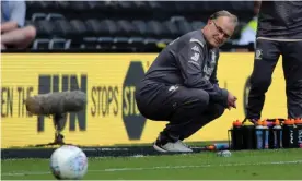  ??  ?? Marcelo Bielsa enjoyed his afternoon as Leeds celebrated promotion with a 3-1 win at Derby. Photograph: Varley Picture Agency/REX/Shuttersto­ck