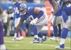  ?? ADAM HUNGER - THE ASSOCIATED PRESS ?? FILE - In this Oct. 6, 2019, file photo, New York Giants defensive tackle Dexter Lawrence (97) waits for the snap against the Minnesota Vikings during the third quarter of an NFL football game, in East Rutherford, N.J.