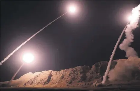  ?? EPA ?? A photo released by the Iranian Revolution­ary Guards’ official website shows what it claims to be missiles being launched against ISIS forces in Syria yesterday. The Zolfaghar and Qiam missiles were reportedly fired from Kermanshah province