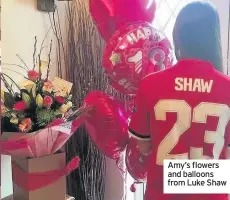  ??  ?? Amy’s flowers and balloons from Luke Shaw