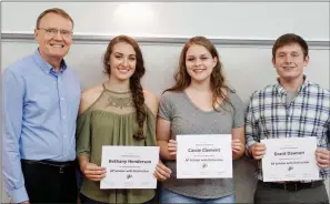  ?? SUBMITTED ?? Roy Wilson, Sheridan’s GT/AP coordinato­r, recognizes Sheridan High School’s four AP Scholars with Distinctio­n at the Sheridan School Board meeting Aug. 14. From left are Wilson; 2017 graduates Bethany Henderson and Cassie Clement; and Grant Dawson, a...