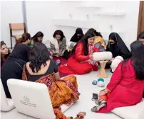  ??  ?? Emirati women teach traditiona­l embroidery craft of telli and indian women showing how ancient craft of block printing is done.