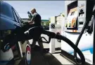  ?? FILE PHOTO ?? Oakland resident Ed Rogers pumps gas at a Chevron station in Berkeley on July 3, 2019.