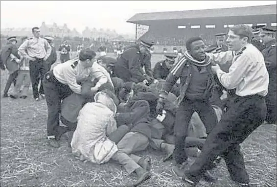  ??  ?? THE WAY WE WERE: Police struggle with anti-apartheid protestors who invaded the pitch during the Springboks match against the North and Midlands rugby team at Linksfield Stadium, Aberdeen.