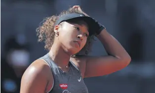  ??  ?? Japan’s Naomi Osaka reacts during her match against the Czech Republic’s Karolina Muchova at the Madrid Open, Madrid, Spain, May 2, 2021.