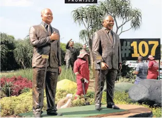  ??  ?? WORKERS clean the area around statues of ANC leaders that have been erected along the M4 Ruth First highway in Durban, as part of the ANC’S election manifesto launch at the Moses Mabhida Stadium in the city. | EPA-EFE African News Agency (ANA)
