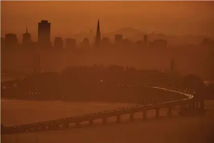  ??  ?? The San Francisco skyline is shrouded in smoke from wildfires in the north part of the state. Photograph: Jose Carlos Fajardo/Associated Press