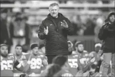  ?? ASSOCIATED PRESS ?? IN THIS NOV. 30, 2019, FILE PHOTO, Utah head coach Kyle Whittingha­m looks on before the start of their game against Colorado in Salt Lake City.