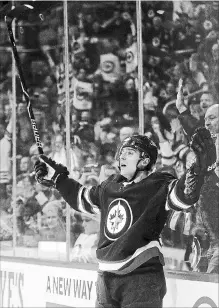  ?? TREVOR HAGAN THE CANADIAN PRESS ?? Winnipeg Jets’ Brandon Tanev celebrates after scoring against the Philadelph­ia Flyers during second-period action Sunday.