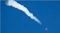  ?? AP ?? The Soyuz-FG rocket booster with Soyuz MS-10 space ship carrying a new crew to the Internatio­nal Space Station flies in the sky at the Russian leased Baikonur cosmodrome on Thursday. —