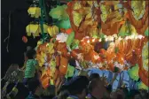  ?? MATTHEW HINTON — THE ASSOCIATED PRESS FILE ?? Float riders throw beads from a float with the theme “Beastly Kingdoms,” in the Krewe of Orpheus parade on Napoleon Avenue during Mardi Gras celebratio­ns in New Orleans on Feb 24.