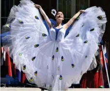  ?? (submitted) ?? Chinese Peacock dance by Jing Xu will be just one of the many performanc­es at Dancing in the Park on Saturday in McKee Park