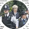  ??  ?? GUARDED PM Theresa May tours Grenfell site last year