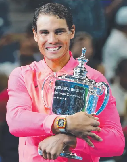  ??  ?? Spain's Rafael Nadal wraps up his second grand slam singles trophy of the year at the US Open in New York.