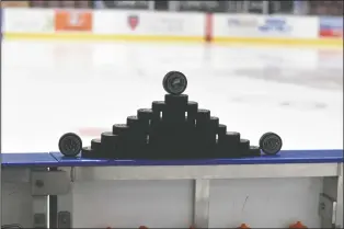  ?? NEWS PHOTO JAMES TUBB ?? Warm-up pucks are stacked ahead of the Medicine Hat Tigers 4-3 overtime win over the Brandon Wheat Kings on Jan. 12.