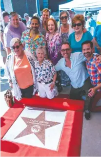  ?? CONTRIBUTE­D PHOTO ?? Family and friends gather around Leslie Jordan's newly introduced star on the Palm Springs Walk of the Stars in Palm Springs, Calif., on Friday.