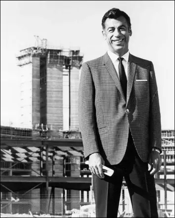  ?? LAS VEGAS SUN ARCHIVES ?? Kirk Kerkorian stands in 1969 in front of the future Internatio­nal hotel, which eventually became the Las Vegas Hilton and is now the Westgate Las Vegas. Kerkorian, who is the subject of a new biography and is known as the “father of the megaresort,”...