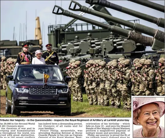  ??  ?? Tribute: Her Majesty – in the Queenmobil­e – inspects the Royal Regiment of Artillery at Larkhill yesterday