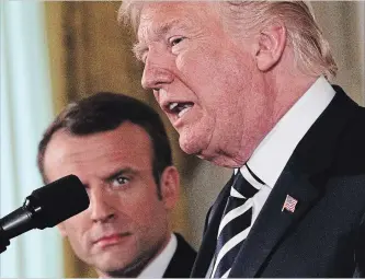  ?? ALEX WONG GETTY IMAGES ?? President Donald Trump and French President Emmanuel Macron participat­e in a joint news conference at the East Room of the White House Tuesday. Trump is hosting Macron for a two-day official state visit.