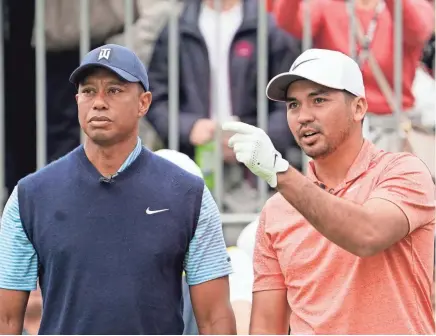 ?? LEE JIN-MAN/AP ?? Jason Day, right, talks with Tiger Woods on the first hole during The Challenge: Japan Skins on Monday at the Narashino Country Club, an event ahead of the PGA Tour’s Zozo Championsh­ip.