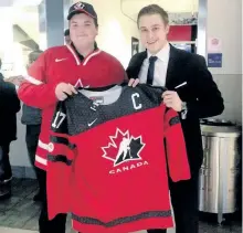  ?? HOCKEY CANADA PHOTO ?? Peterborou­gh native Mitchell Stephens, sidelined from Thursday night's Team Canada game against Latvia at the world junior hockey championsh­ips with an ankle injury, presented a jersey to Ryan from Children's Wish, making him as an honourary member of...