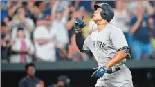  ?? NICK WASS/AP PHOTO ?? Aaron Judge celebrates his home run during the seventh inning of the Yankees’ 4-1 win over the Orioles in Friday night in Baltimore.