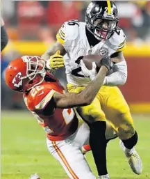  ?? Matthew Stockman Getty Images ?? STEELERS running back Le’Veon Bell, seen dealing with Marcus Peters, played well, but his team won without scoring a TD.