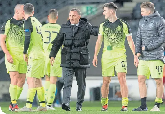  ??  ?? Brendan Rodgers celebrates with his players after Celtic’s win against Rosenborg in Trondheim on Thursday night