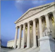  ?? JON ELSWICK, FILE - THE ASSOCIATED PRESS ?? In this 2016 file photo, people stand on the steps of the Supreme Court at sunset in Washington. The Supreme Court is stopping Louisiana from enforcing new regulation­s on abortion clinics in a test of the conservati­ve court’s views on abortion rights.