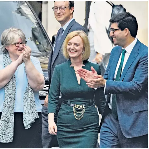  ?? ?? Liz Truss is applauded by her campaign team in Westminste­r after picking up enough votes to see Penny Mordaunt pushed out of the Tory leadership contest