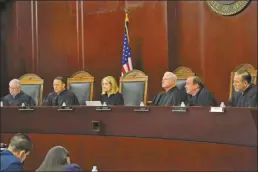  ?? AP file photo ?? Arizona Supreme Court Justices from left; William G. Montgomery, John R Lopez IV, Vice Chief Justice Ann A. Scott Timmer, Chief Justice Robert M. Brutinel, Clint Bolick and James Beene listen to oral arguments on April 20, 2021, in Phoenix. The Arizona Supreme Court ruled Tuesday, that the state can enforce its long-dormant law criminaliz­ing all abortions except when a mother’s life is at stake.