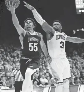  ?? GREGORY SHAMUS/GETTY IMAGES ?? Mount St. Mary’s guard Elijah Long drives to the basket against New Orleans’ Nate Frye on Tuesday in Dayton, Ohio.