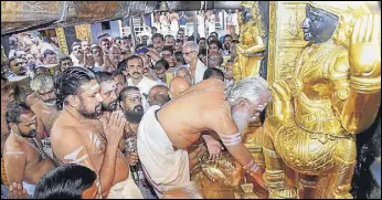  ?? PTI ?? Melsanthi Unnikrishn­an Nampoothir­i opens the Lord Ayyappa temple for the fiveday monthly pooja in the Malayalam month of 'Thulam', in Sabarimala, Kerala on Wednesday.
