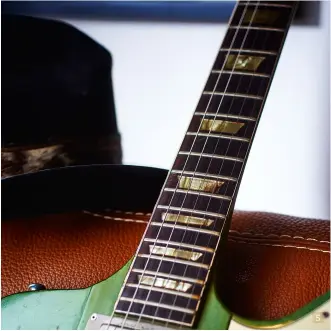  ??  ?? 4. Johnny’s weathered strap was among the personal items, such as hats and notebooks, on sale with the guitars 5. The Firebird has a distinct neck-throughbod­y design 5