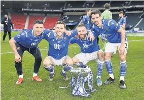  ??  ?? Cup of cheer Saints players with the trophy