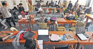  ?? PICTURE: DAVID RITCHIE ?? NEW DIGS: UCT Students protesting against the removal of the Rhodes statue at UCT have occupied the Archie Mafeje Room in the Bremner Administra­tion Building since last Friday.