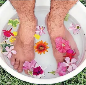  ??  ?? Us men should look after our feet - they work hard for us, day in day out. Maybe just leave out the flower petals...