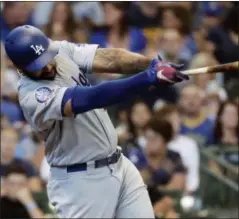  ?? MORRY GASH — THE ASSOCIATED PRESS ?? Los Angeles Dodgers’ Matt Kemp hits a home run during the third inning of a baseball game against the Milwaukee Brewers Sunday in Milwaukee.