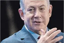  ?? ANDREW HARRER
BLOOMBERG ?? Israeli Prime Minister Benjamin Netanyahu visited an Israeli town that was pounded over the weekend with rockets. The visit follows a massive bombardmen­t by Israel of Hamas targets.