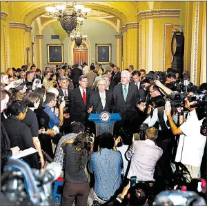  ?? AP/ CAROLYN KASTER ?? Senate Majority Leader Mitch McConnell ( center) said Tuesday that while he regrets not being able to pass the Senate health care bill, “that doesn’t mean we should give up.”